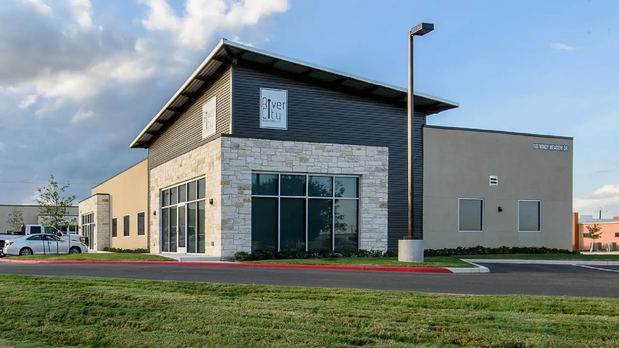 A building with a large window on the front of it.